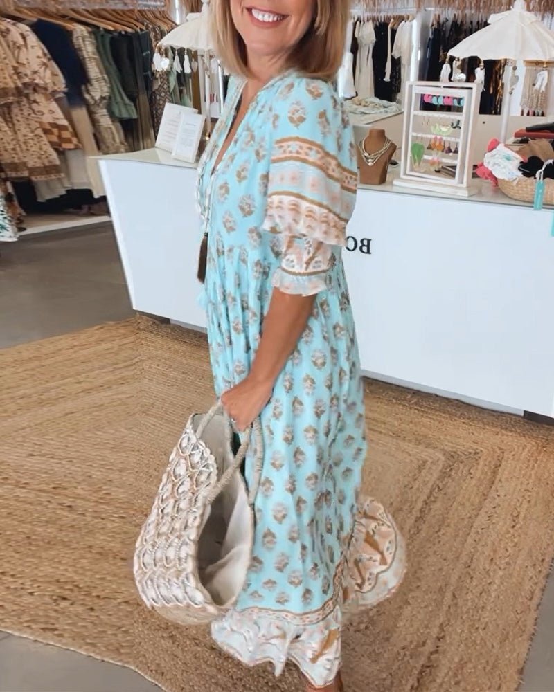 MANA | ROBE FLORALE CHIC MI-LONGUE AVEC ENCOLURE EN V