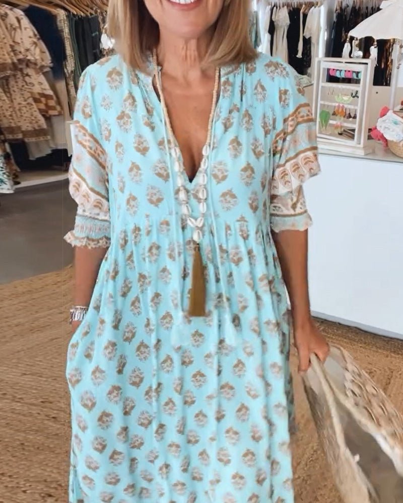 MANA | ROBE FLORALE CHIC MI-LONGUE AVEC ENCOLURE EN V